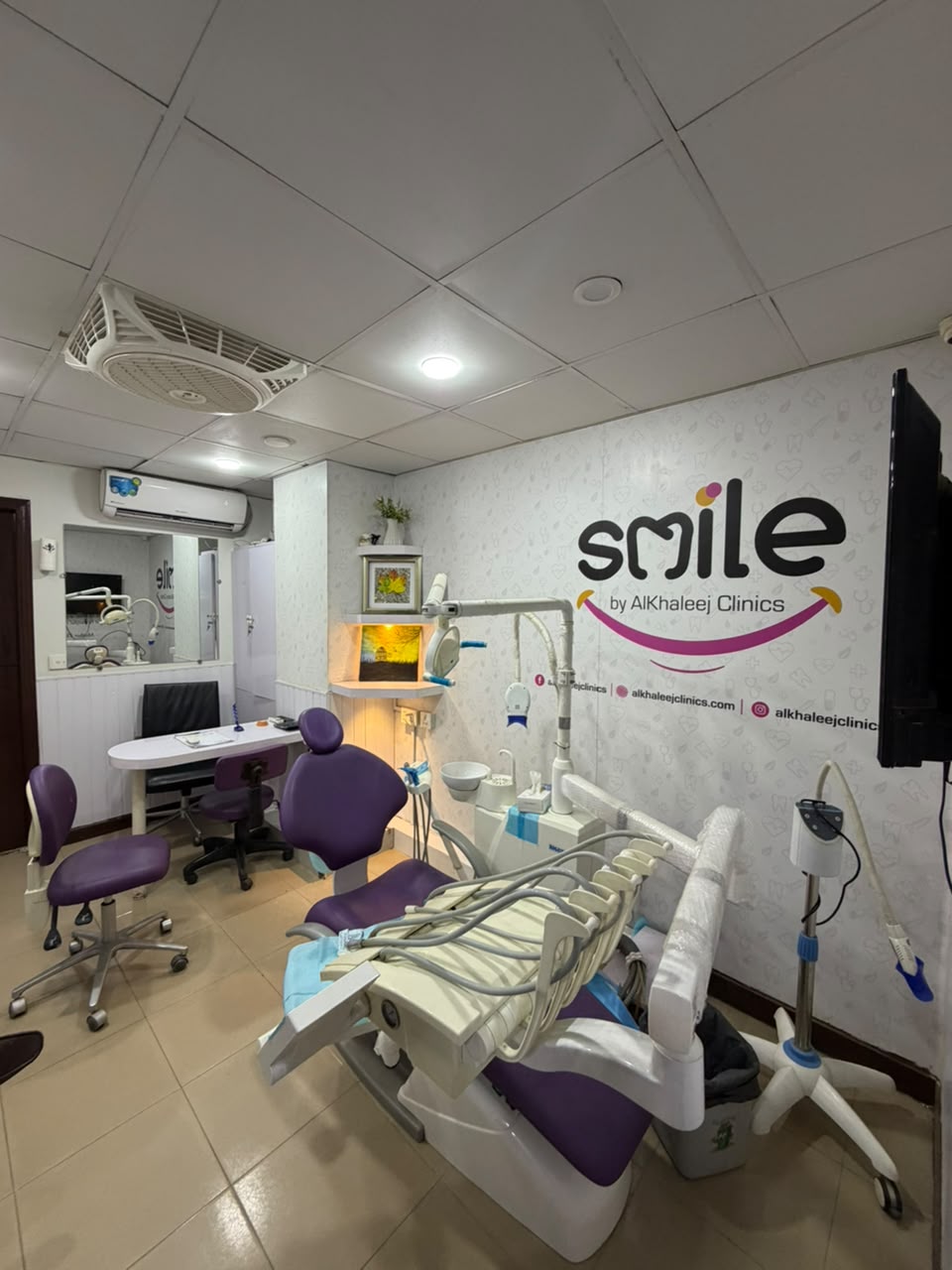 Purple dental chair and clinical equipment in a Smile by Alkhaleej treatment room