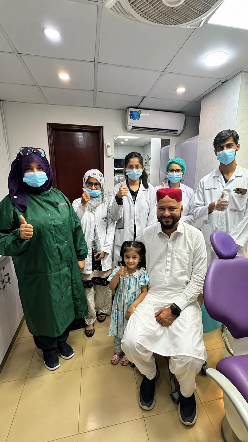 Smile by Alkhaleej clinical team with a young patient and her family